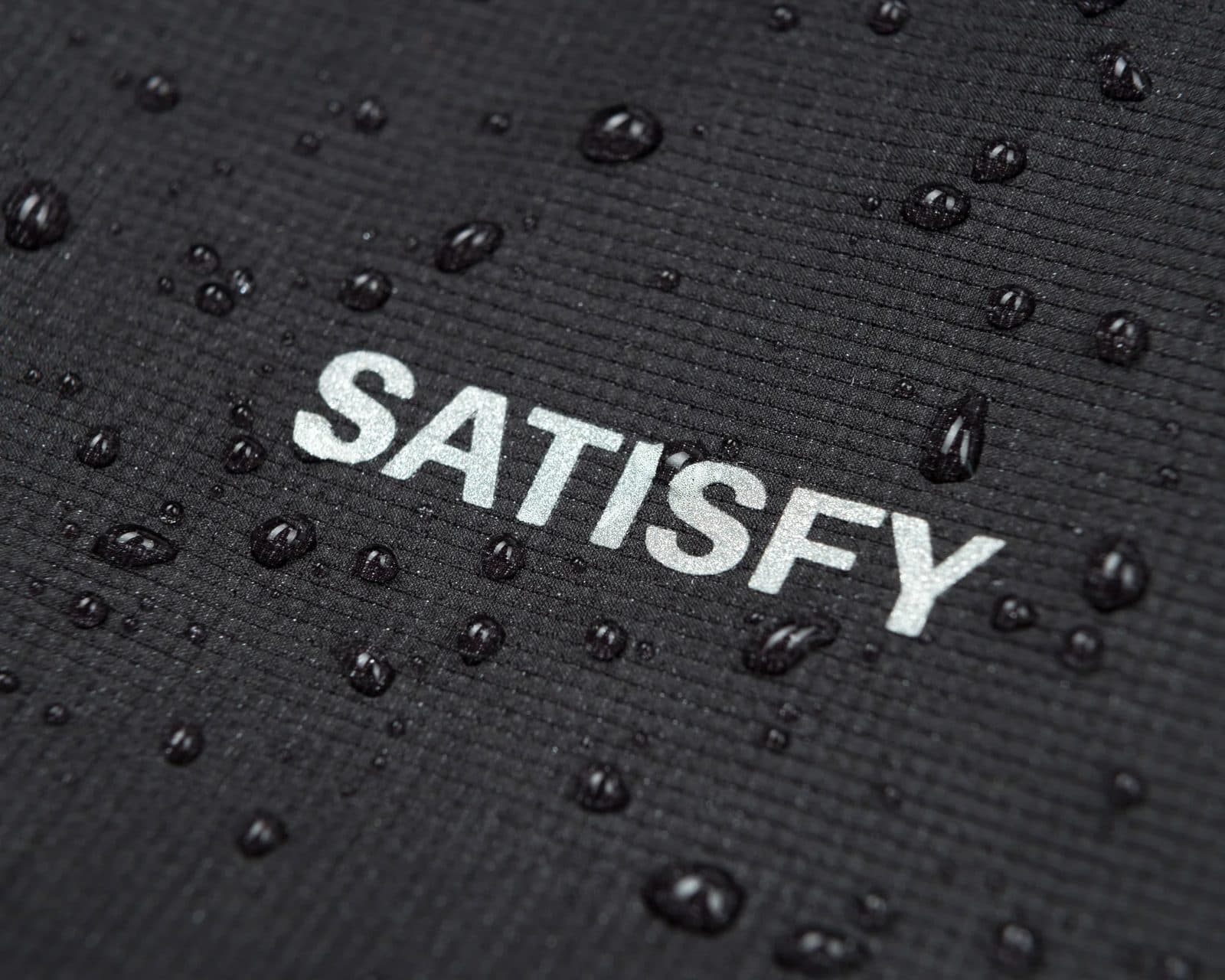 Close-up of water-repellent fabric with logo